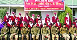 Girls pose with BSF officials after returning from Bharat Darshan tours on Thursday