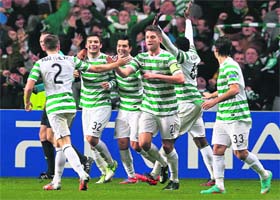 Celtics Tony Watt (C) celebrates after scoring during their Champions League Group G win over Barcelona in Glasgow on Wednesday