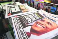 Newspapers with Barack Obama winning the US presidential election on their frontpages are displayed at a news stand in New York.  Reuters