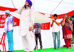 Artistes enact a play during the awareness campaign against the ill effects of drugs, started by the BSF, Punjab Frontier, at Rajatal on Friday