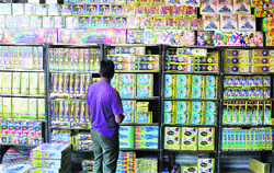 A man looks at crackers at Parade Ground in Jammu on Friday.