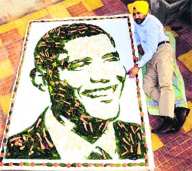 Veggie art: Amritsar artist Harwinder Singh Gill displays a portrait of US President Barack Obama, prepared with vegetables