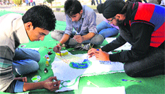 Students paint a T-shirt during the PEC Fest on Saturday. Tribune photo: Pradeep Tewari