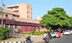 Vehicles parked in a no parking area outside the Reserve Bank of India building in Jammu. Tribune photo: Inderjeet Singh