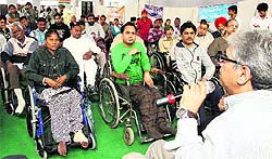 Dr Manoj Dabar, a resource person from the Indian Spinal Injury Centre, addresses people affected with spinal cord injuries during the first state conference by the Spinal Cord Injury Association in Jalandhar on Saturday