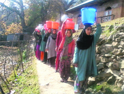 Daily grind: Women fetch drinking water from a pond which at Muqam village in Kupwara. Photo by writer 