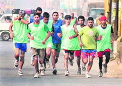 Runners participate in Srinagar marathon on Saturday in Srinagar. A tribune photograph