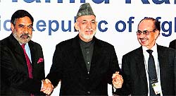 Afghanistan President Hamid Karzai with Union minister Anand Sharma and industrialist Adi Godrej in Mumbai on Saturday