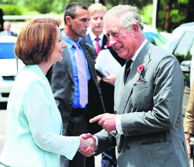Britains Prince Charles with Australian Prime Minister Julia Gillard before unveiling a plaque to rename a road Queen Elizabeth Terrace in Canberra on Saturday.