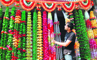 Most shop owners have decided to go grand this time with huge, decked up entrance gates outside the shops.