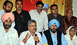 Legislator Sarup Chand Singla (left) addressing mediapersons in Bathinda on Sunday. Sitting to his left is Mayor Baljit Singh Beerbehman