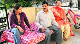Baldev Chand with his wife and daughter.