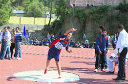 A girl in action on the second day of college athletics meet at Hamirpur on Friday.