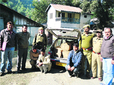 Forest officials with the deodar timber smuggling accused in Chamba.