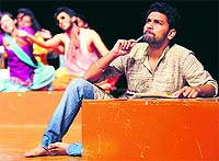 Artists enact in a play Nithalley ki diary at the Tagore Theatre in Chandigarh on Monday