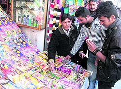 People buy crackers on the eve of Divali in Mussoorie