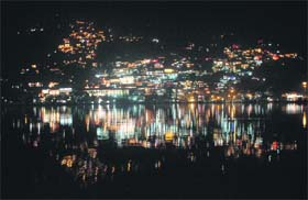 The illuminated Nainital city and its reflection in Naini Lake as the city celebrates Chhoti Divali on Monday