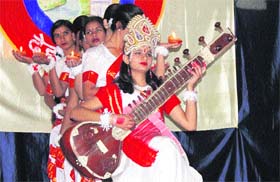 Kanya Gurukul Mahavidyalaya students perform Saraswati vandana in Dehradum on Monday