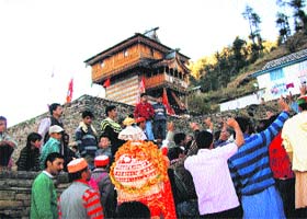 The Shilgur Devta emerges from a temple for Divali celebrations at Shantha-Bateuri village in Chopal, Shimla, on the third day after the festival