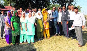 Villagers and relatives of deceased Shashi Pal Sharma, ex-pradhan of Bhalakh gram panchayat, at Nurpur on Monday