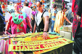 They are all set for Divali as they select items of decoration at a market in Jammu.