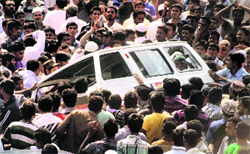 An angry mob vandalises a vehicle in Hyderabad on Monday.  PTI