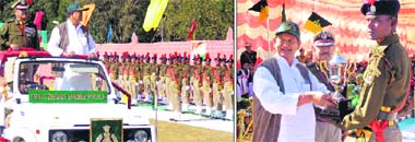 Union Minister of Water Resources Harish Rawat inspects the guard of honour during the passing-out parade at the ITBP training centre at Mirthi in Pithoragarh on Wednesday; and (right) the minister presents an award to a recruit