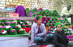 Women sell traditional goods at the Lavi Fair in Rampur on Wednesday.