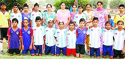 Members of the Shere Punjab Sports Academy, Chakar, after winning a football tournament on Wednesday