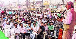 Dr Arun Mitra, city secretary of CPI, addresses a workers' rally at Basti Chowk in Ludhiana on Wednesday