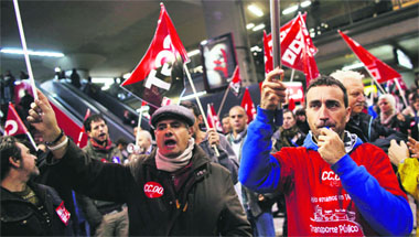 Picketers from trade unions shout slogans during a nationwide general strike in Madrid on Wednesday. 