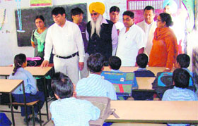 Punjab SC Commission Chairman Rajesh Bagha during his visit to government schools in Amritsar on Thursday.