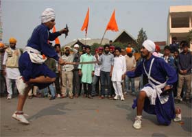 Sikhs display their martial arts skills while the Chetna March was passing through Bathinda