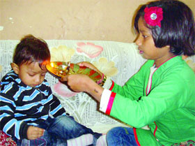 A sister prays for his little brothers happiness on the occasion of Bhai Dooj in New Delhi on Thursday.