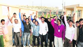 Class IV employees hold a protest at the Punjab Institute of Medical Sciences