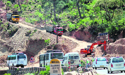 Vehicles plying on the Jammu-Srinagar national highway, which is being widened. Tribune photo: Inderjeet Singh