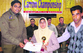A winner gets award at the prize distribution function in Srinagar on Thursday.