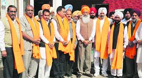 Sukhdev Singh Dhindsa (centre), general secretary, SAD, with Congress workers who joined the ruling party in Chandigarh on Thursday
