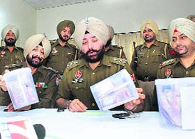 SSP Gurpreet Singh Gill shows the fake currency notes