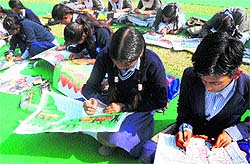 Students take part in a painting competition at Kala Gram in Chandigarh on Friday