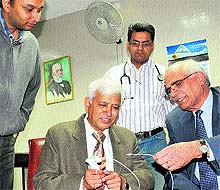 Dr Jyoti S Datta (right) explains the thermoplasty technique to Dr SK Jindal at the PGI in Chandigarh on Friday