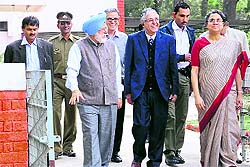 Prime Minister Manmohan Singhs daughter, Prof Upinder (right), comes out of the house where she stayed during her childhood, at the PU on Friday