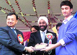 A student being presented with an award during the 124th annual athletics meet at Oak Grove School in Mussoorie on Friday