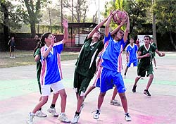 Players in action during a match in a basketball tournament in Dehradun on Friday