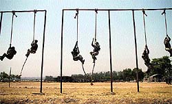CRPF men take part in a training session at a training centre in Nagrota in the Jammu region