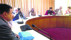 Sarpanches and panches hold a meeting at the Dak bungalow in Rajouri district on Friday. A Tribune photograph
