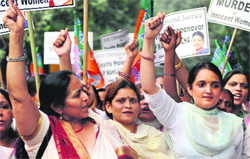 BJP Mahila Morcha activists protest against the Irish government over the death of an Indian dentist, in New Delhi on Friday. 