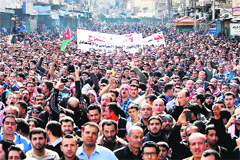 Thousands of Jordanian protesters march in Amman during a demonstration against an increase in fuel prices, on Friday. 