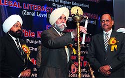 Justice Jasbir Singh lights the ceremonial lamp at the zonal level legal literacy youth festival held at the Adesh University in Bathinda on Saturday