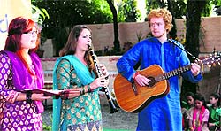 A German group presents a song on the 66th founders day celebrations of Nanhi Duniya in Dehradun on Saturday